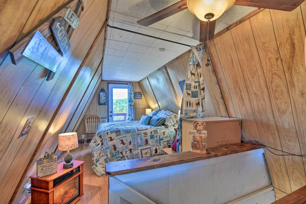 photo 1 of Steps to Lake! Charming Cabin: Pool Access & Decks