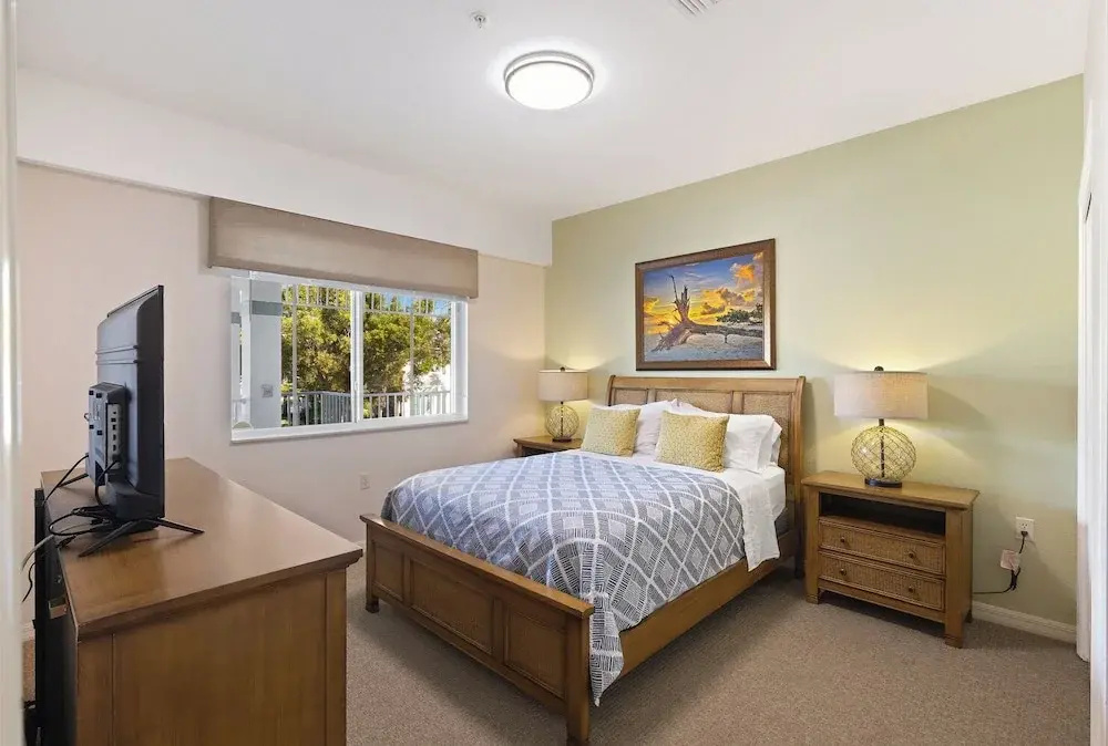 photo 1 of Genoa Vacation Rental: Stylish 2-BR Condo with Golf & Lake Views. Resort-Style Pool, Hot Tub, and Easy Access to Championship Golf. Minutes from Naples Beaches, 5th Avenue S, and Marco Island