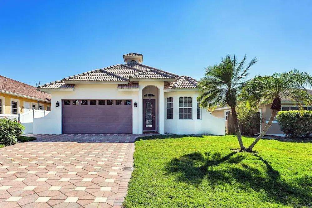 photo 1 of Imola: Newly Remodeled Pool Home Minutes from Vanderbilt Beach. Family-Friendly Retreat with 4 BR, 3.5 Bathrooms, and Private Screened Pool. Perfect Location Near Mercato and Naples Attractions