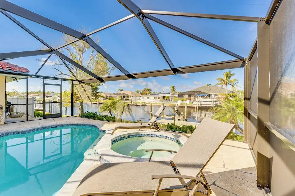 photo 1 of Luxe Waterfront Oasis w/ Dock, Heated Pool & Spa!