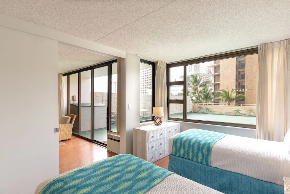 photo 1 of Pool Deck Level Condo at the Waikiki Banyan - Free Parking! by Redawning