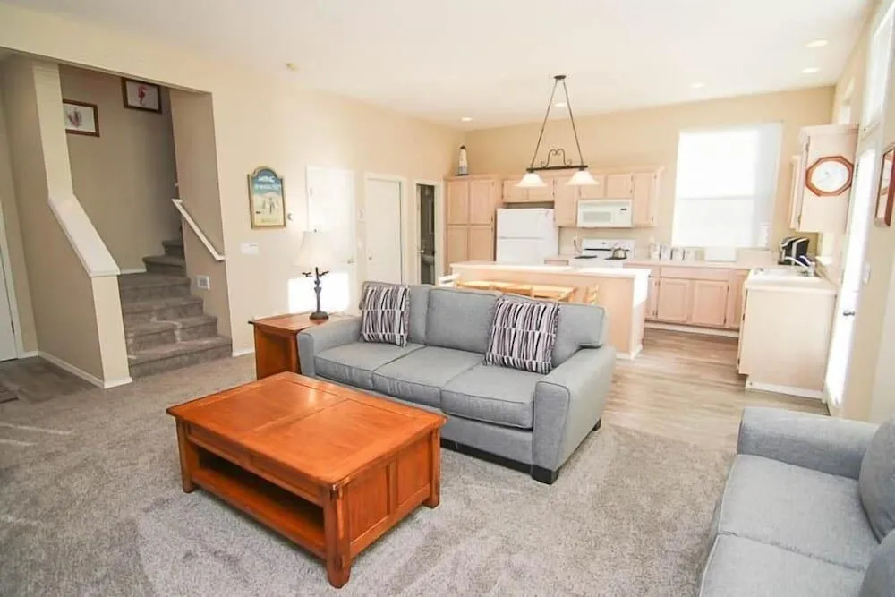 photo 1 of Cozy Gathering Space and Sparkling Amenities - Charming Seaside Haven