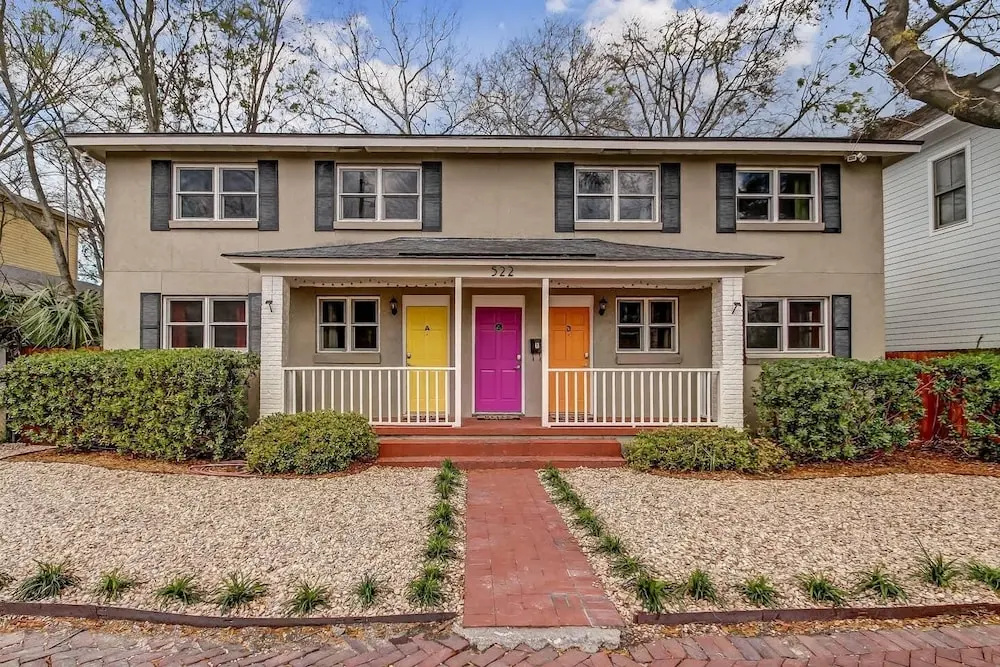photo 1 of Vibrant, Colorful Condo Building With Backyard Firepit and Games