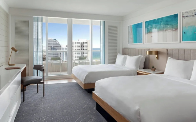 Quadruple room with balcony and with partial ocean view