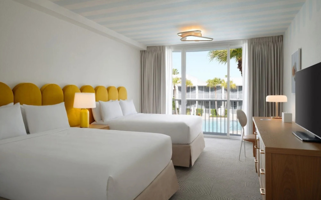 Room with balcony and with pool view