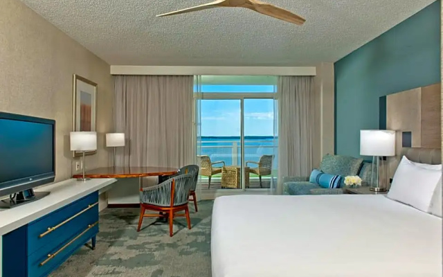 Room with balcony and with water view