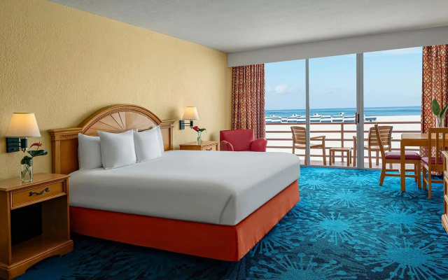 Room with balcony and beachfront