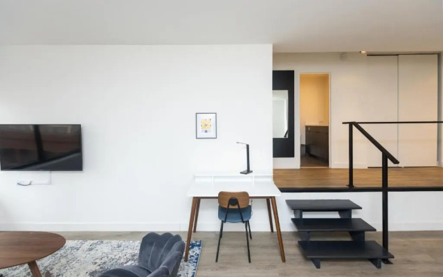 photo 3 of 21 East - Chic DT Apts with Rooftop by Zencity