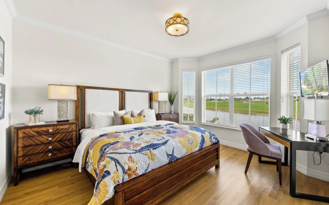 photo 3 of Catina Vacation Rental: Bright 2-BR Condo with Lake Views. Located in Lely Resort with Pool, Hot Tub, and Golf Access. Ideal for Golfers and Beachgoers, Minutes from Naples and Marco Island