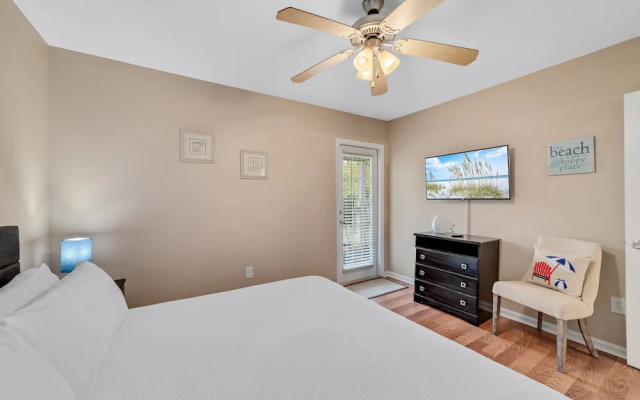 photo 4 of Charming Condo With Luxe Amenities Less Than 10 Minutes From the Beach
