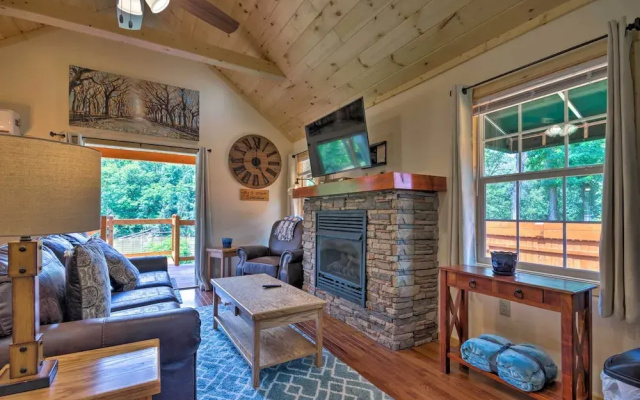 photo 2 of Deck & Hot Tub: Bryson City Riverfront Cabin!