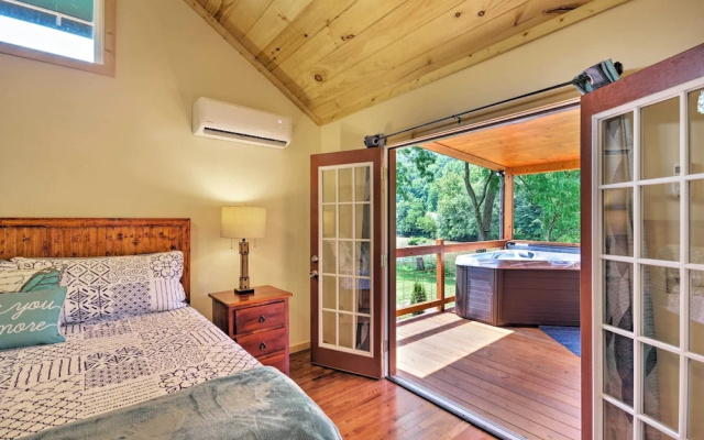 photo 5 of Deck & Hot Tub: Bryson City Riverfront Cabin!