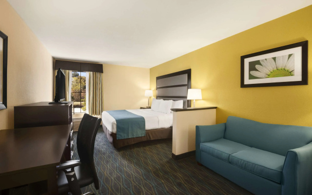 photo 2 of Days Inn & Suites by Wyndham Commerce