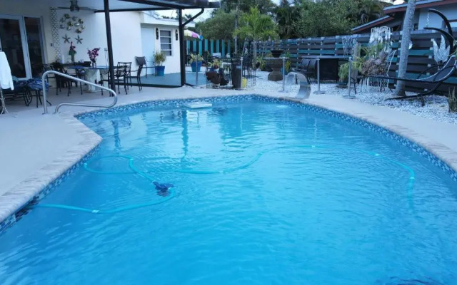 photo 3 of JUNGLE TO BEACH 4 R 3 BR Family and Pet Heated pool N Airport N Beach N Hard Rock