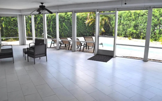 photo 5 of Lovely 3-bd, walk to bars, 9 min drive from beach! Heated pool.