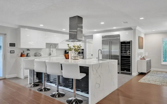 photo 4 of Luxe 4BR Waterfront w Htd Pool 5min to Beach