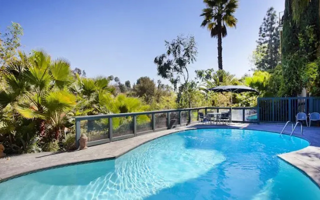 photo 4 of MidCentury Poolview Retreat by LuxPads