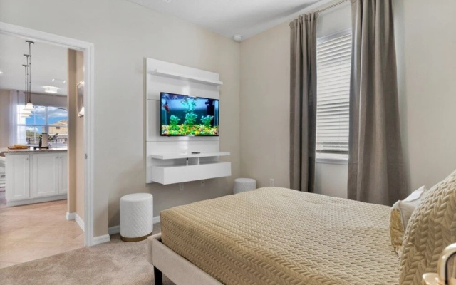 photo 4 of New Luxury Home In Solterra Resort Kissimmee! 5 Bedroom Home by Redawning