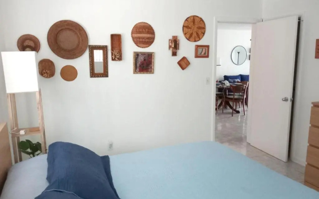 photo 4 of Private designer 8 room art getaway 2 Br-2Ba Full Kitchen Barbecue Patio 2min to beach