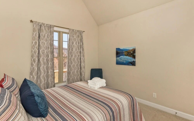 photo 4 of Rumbling Bald Resort Home In Lake Lure - Wifi - Community Beach, Pool, Golf And More 5 Bedroom Home by Sunscape Property Management