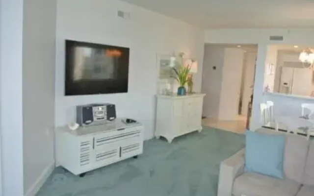 photo 3 of Deluxe Beachfront Condo Located in Prestigious Resort with Pool and Hot Tub by RedAwning