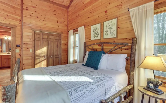 photo 2 of Secluded Cherry Log Cabin w/ Hot Tub + Swings!