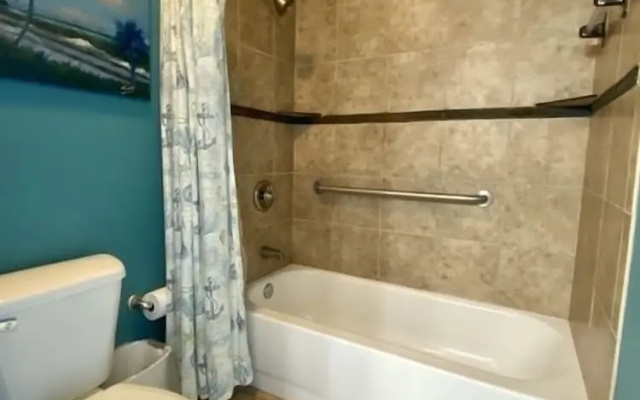 photo 4 of Wonderful Tropical Condo with Beach and Fitness Center Access - Unit 0102 by RedAwning