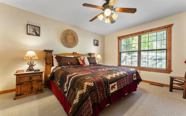 photo 2 of Whispering Woods Lodge - Sleeps 6 2 Bedroom Home by RedAwning
